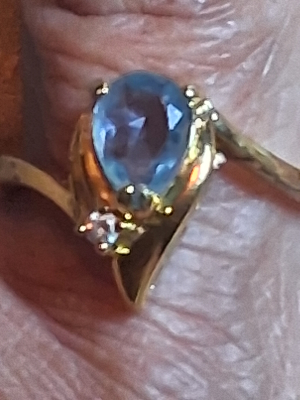 Gold Ring with Blue Teardrop Stone and Clear Accent